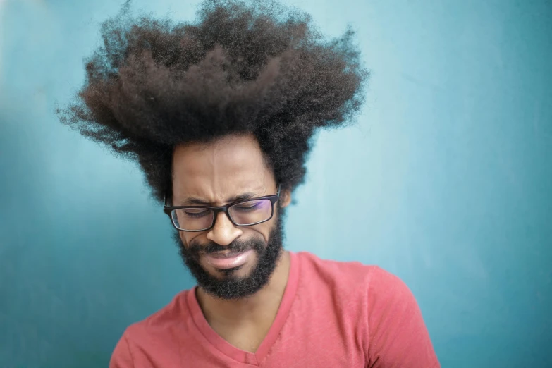 a close up of a person with a cell phone, an album cover, by Washington Allston, pexels contest winner, renaissance, his hair moves with the wind, afro, man with glasses, 15081959 21121991 01012000 4k