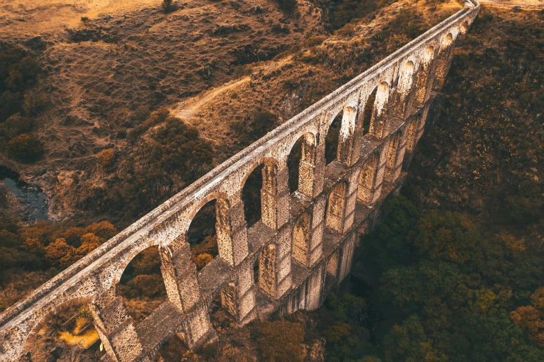 a group of people standing on top of a bridge, a screenshot, pexels contest winner, renaissance, aqueducts, train far, profile image, towering high up over your view