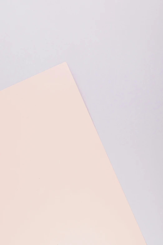 a piece of paper sitting on top of a table, light pink background, complementary palette, smooth surface, viewed from behind