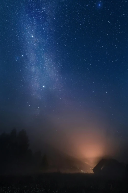 the milky shines brightly in the night sky, a picture, by Michał Karcz, unsplash contest winner, made of mist, panorama view of the sky, galaxy in background, foggy light from fires