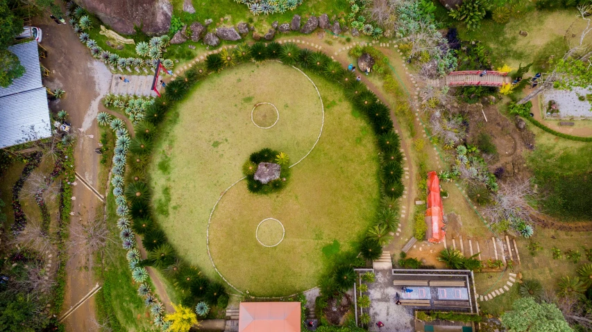 a bird's eye view of a soccer field, an album cover, pexels contest winner, land art, yinyang shaped, health spa and meditation center, te pae, round-cropped