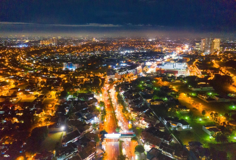 an aerial view of a city at night, by Basuki Abdullah, ultrawide landscape, cinematic shot ar 9:16 -n 6 -g, high quality image”, instagram post