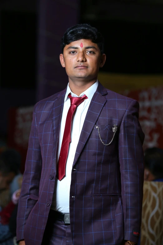 a man in a purple suit and red tie, samikshavad, wearing fashion suit, indore, high quality upload, fashion show photo