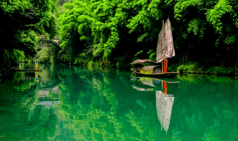 a boat that is sitting in the water, by An Zhengwen, pexels contest winner, lush green, mirror world, hou china, sichuan