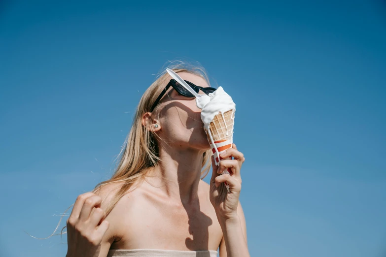 a woman in a bikini eating an ice cream cone, pexels contest winner, surrealism, her face flushing and sweat, shades, conch shell, skincare