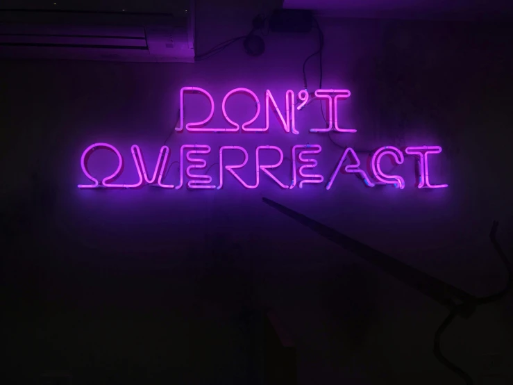 a neon sign that says don't overreact, pexels, ((purple)), virgil abloh, divine ray over her head, dnd
