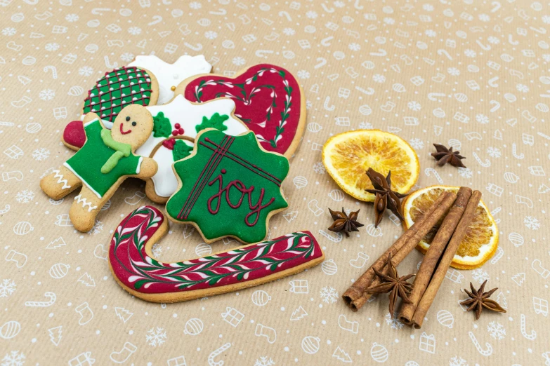 a couple of cookies sitting on top of a table, by Joanna Carrington, pexels, folk art, vibrant red and green colours, detailed product image, santa, full product shot