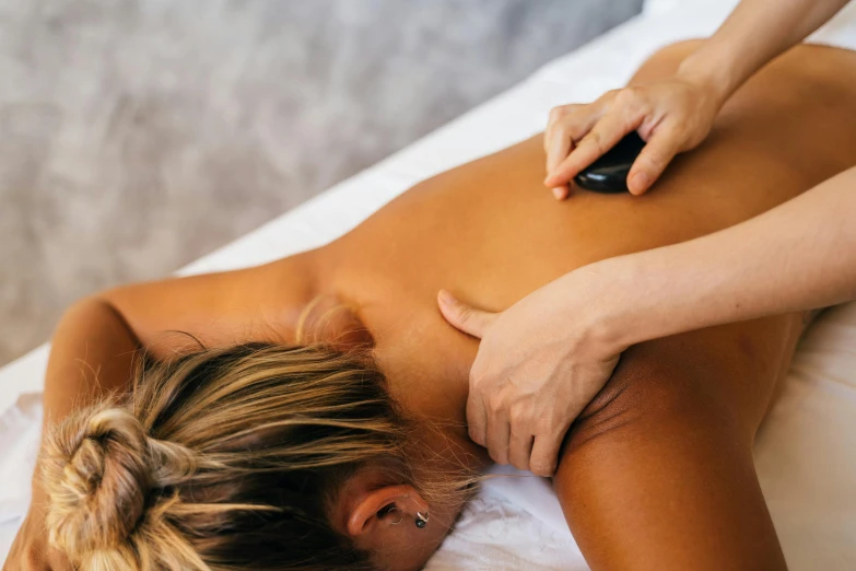 a woman getting a back massage at a spa, a mosaic, unsplash, “ iron bark, lachlan bailey, thumbnail, regular sized