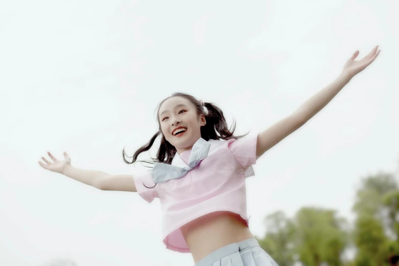 a girl is jumping in the air on a skateboard, by Fei Danxu, pexels, japanese girl school uniform, avatar image, a still of a happy, wearing a crop top