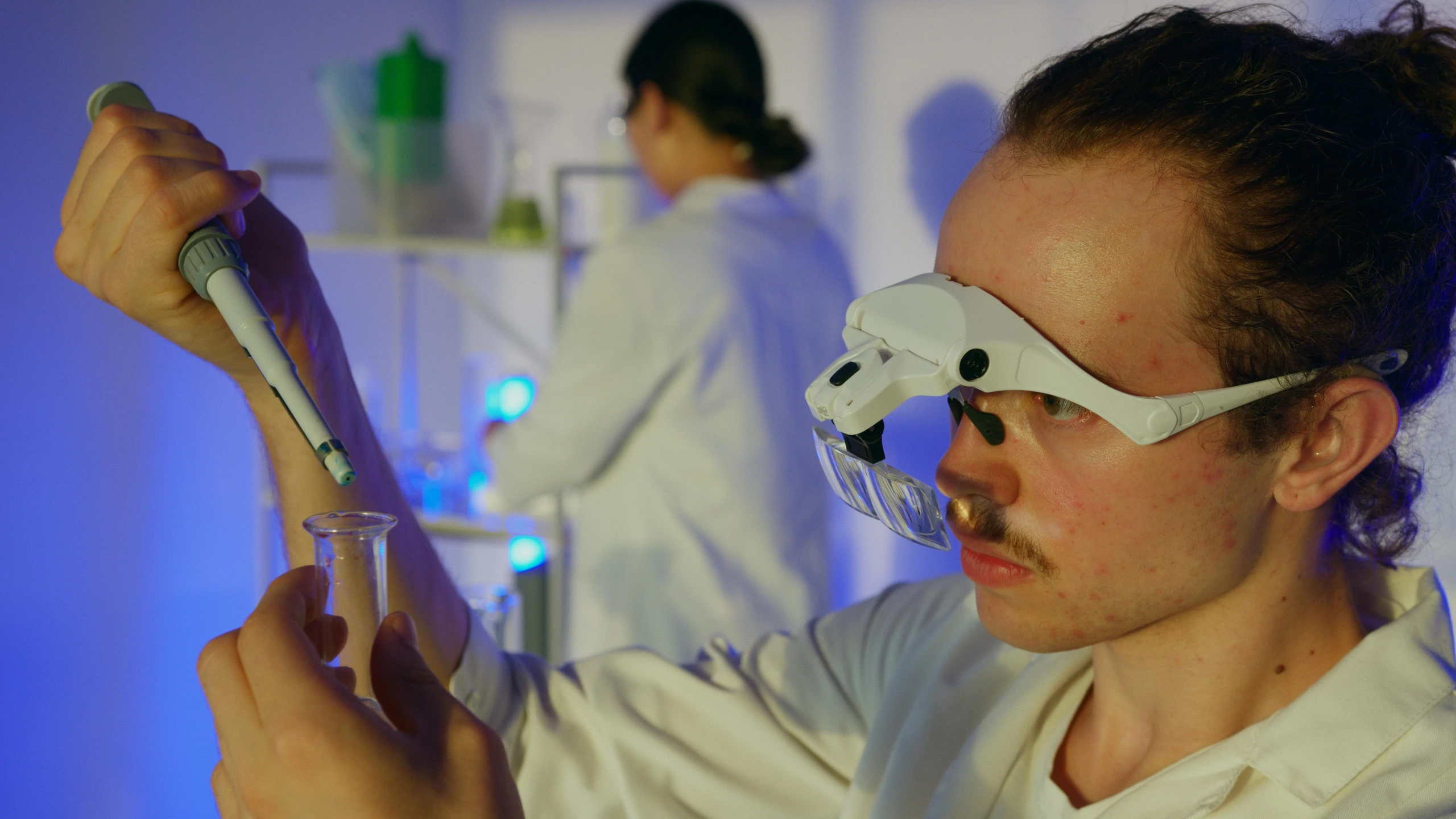 a close up of a person wearing a pair of glasses, scientific glassware, scene, liam brazier, thumbnail