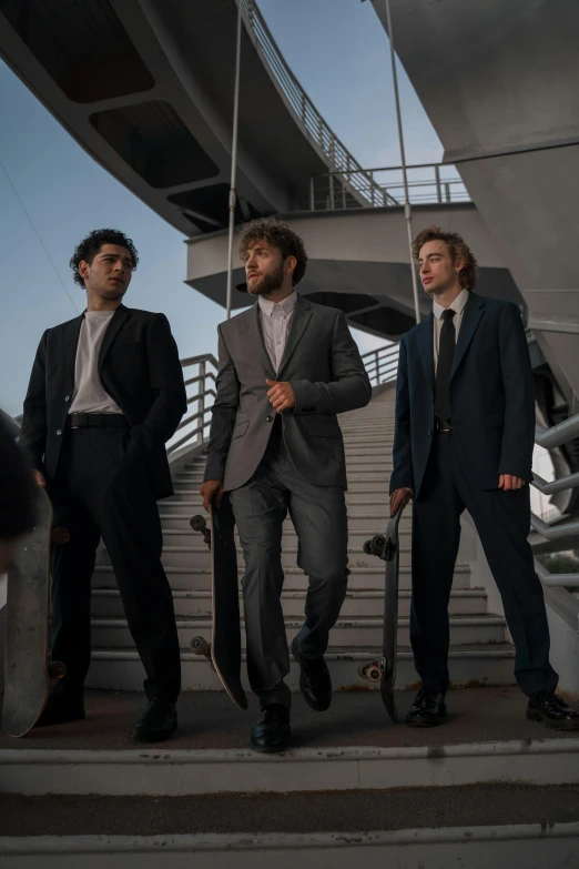 a group of men standing next to each other, an album cover, pexels contest winner, business clothes, ( ( theatrical ) ), moonlight grey, three quarter shot