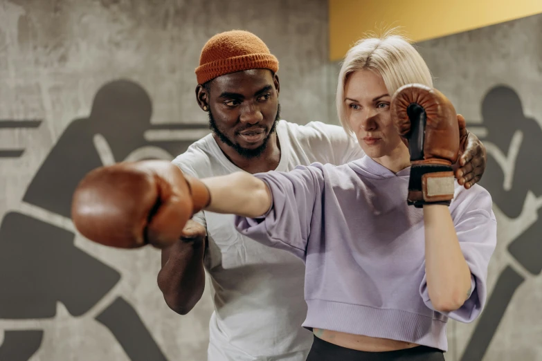 a man and a woman boxing in a gym, by Arabella Rankin, pexels contest winner, giving the thumbs up, brown, thumbnail, manuka