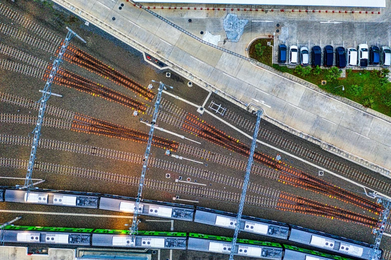 a large long train on a steel track, by Carey Morris, pexels contest winner, happening, dji top down view, square, panoramic shot, terminals