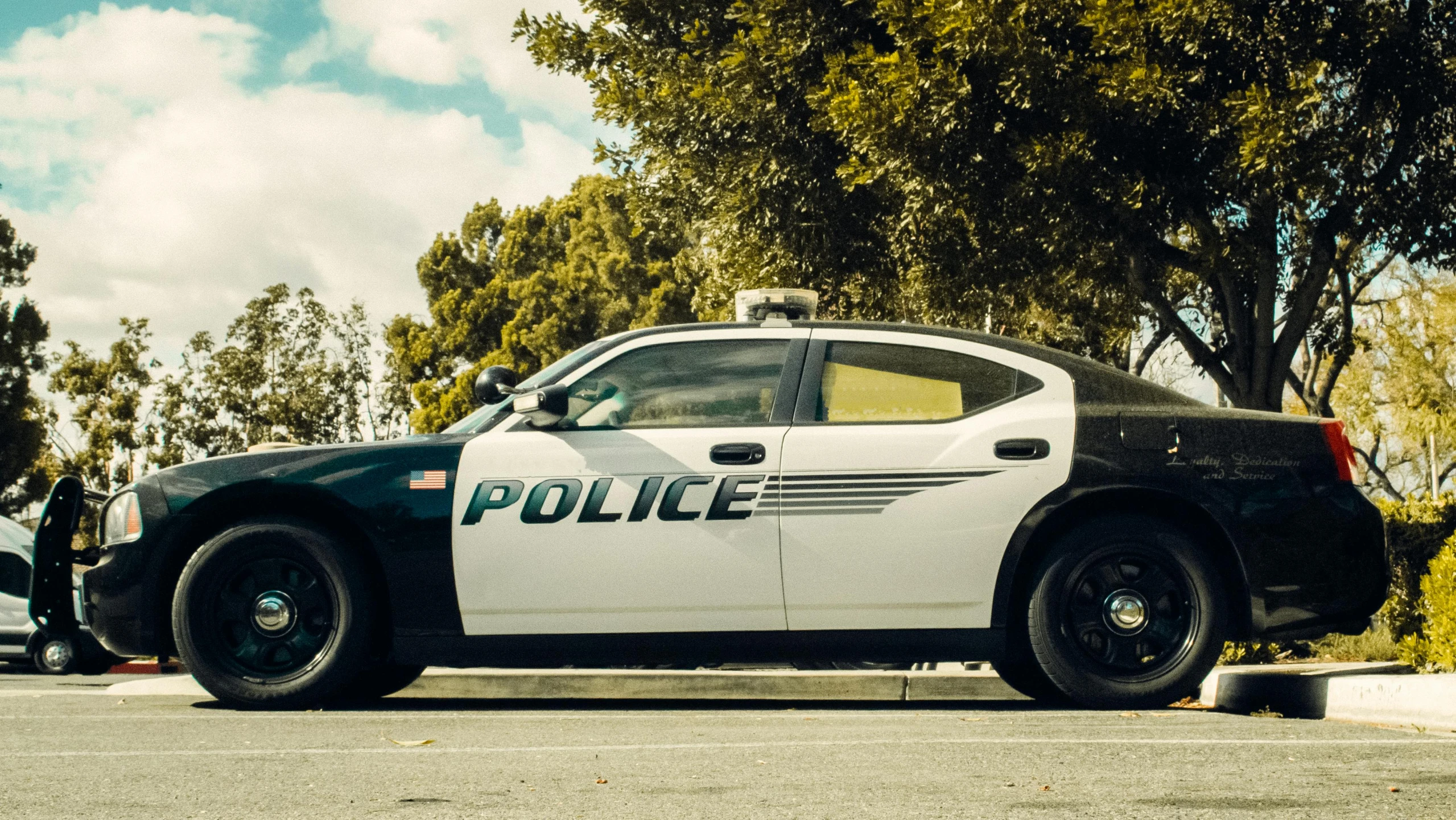 a police car parked on the side of the road, by Carey Morris, pixabay, renaissance, avatar image