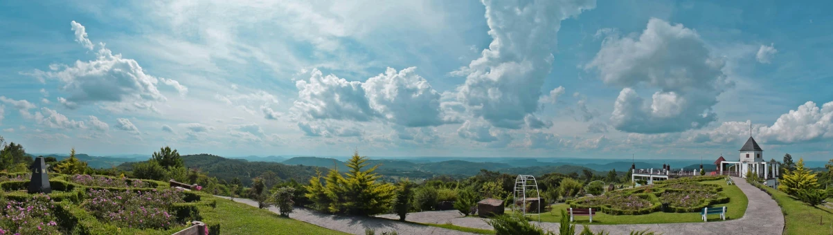 a view of a church from the top of a hill, pexels contest winner, process art, panorama view of the sky, above lush garden and hot spring, looking over west virginia, dramatic clouds cyan atmosphere