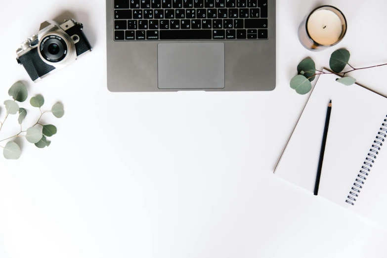 a laptop computer sitting on top of a white desk, by Carey Morris, trending on unsplash, 9 9 designs, white bg, various items, background image