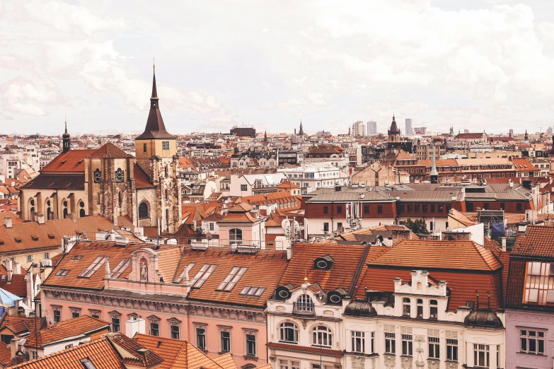 a view of a city from the top of a building, by Emma Andijewska, pexels contest winner, baroque, orange roof, brown, 1990's photo, no watermarks