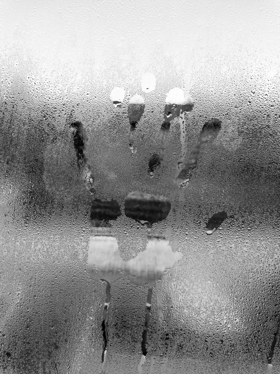 a black and white photo of a window with a smiley face drawn on it, an etching, by Mirko Rački, hands touching light drops, it\'s raining, andrey gordeev, abstract horror