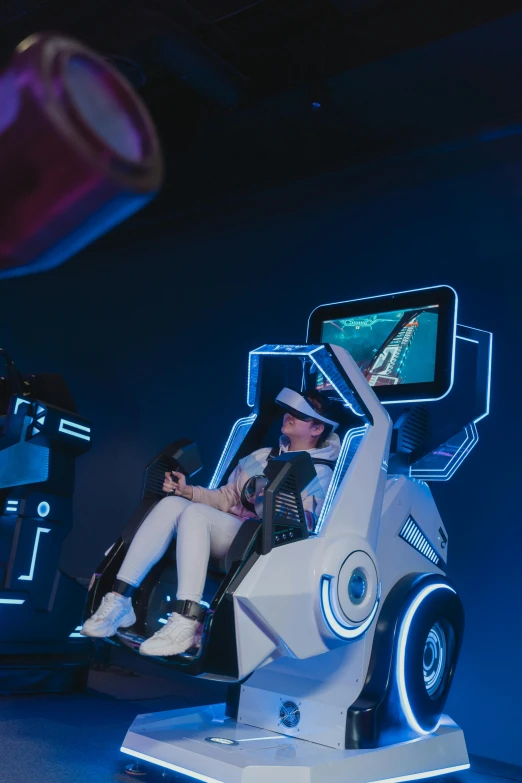 a couple of people that are sitting in a car, a hologram, inspired by Hendrick Cornelisz Vroom, unsplash, interactive art, gaming chair, kantai collection arcade, chappie in an adidas track suit, piloting a small space shuttle