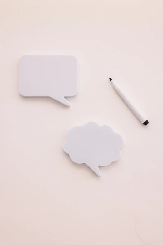 two speech bubbles and a marker on a white surface, by Paul Bird, trending on unsplash, society 6, detailed product image, whiteboards, soft aesthetic