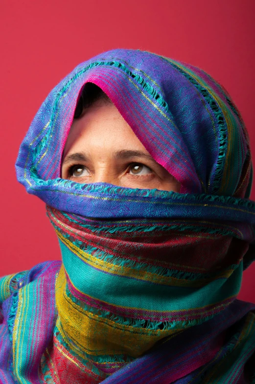 a woman with a scarf covering her face, an album cover, shutterstock contest winner, 2 5 6 x 2 5 6 pixels, colorful, muslim, vivid gaze