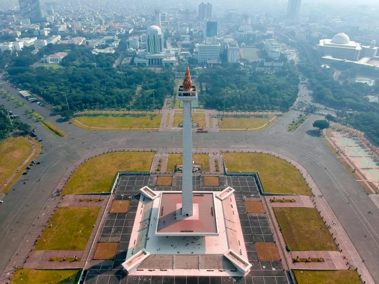 an aerial view of a city with a clock tower, by Bernardino Mei, pexels contest winner, visual art, jokowi, obelisk, avatar image