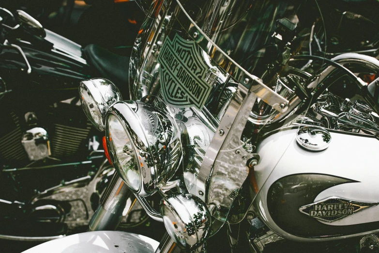 a group of motorcycles parked next to each other, pexels contest winner, photorealism, made out of shiny silver, harley davidson motorbike, glass reflections, high details photo