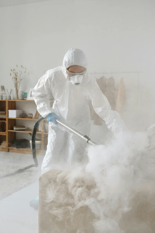 a man in a white coverall cleaning a room, process art, soft smoke, sustainable materials, avatar image, foam