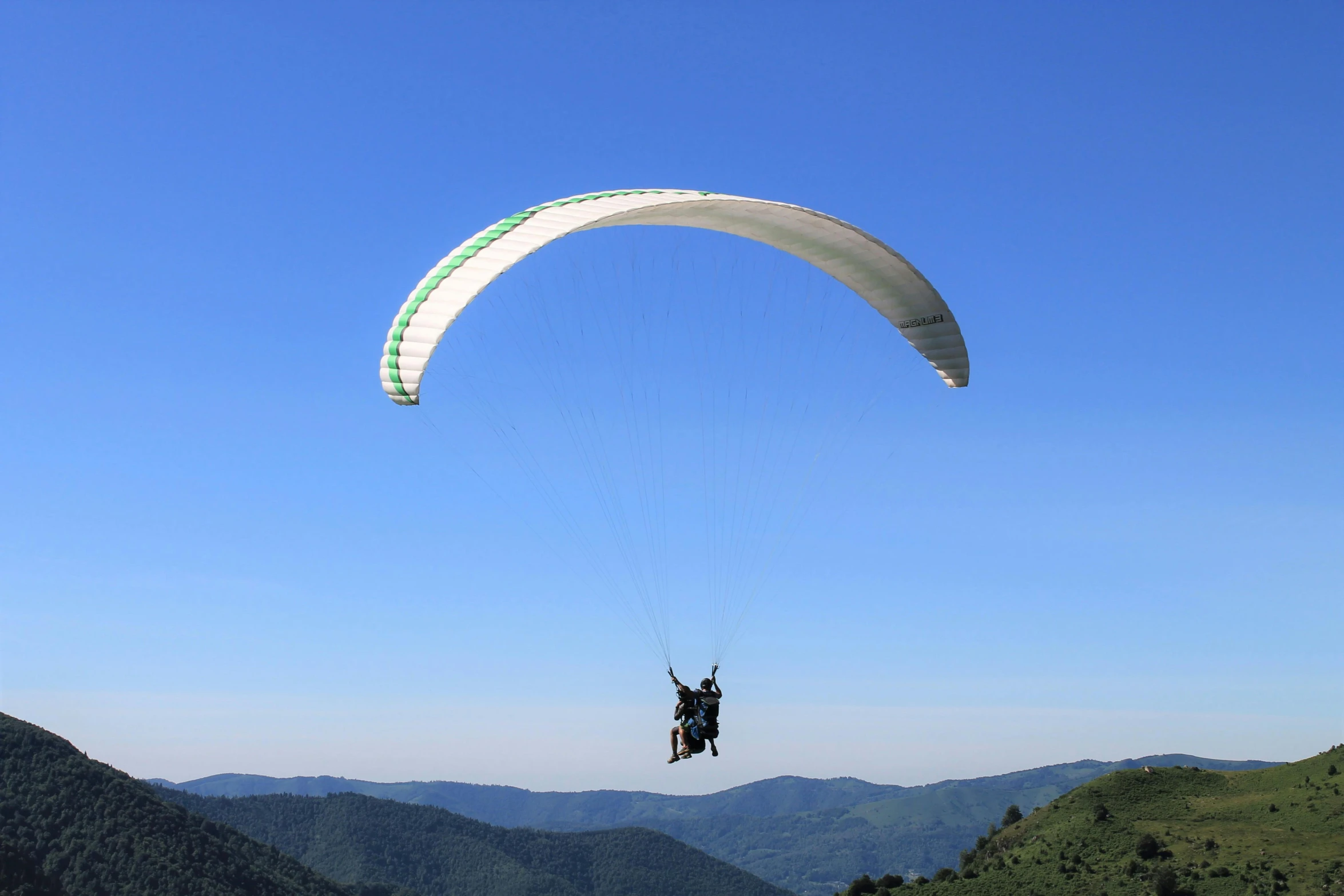 a person that is in the air with a parachute, by Niko Henrichon, pexels contest winner, hurufiyya, panorama, mechabot, a green, two hang