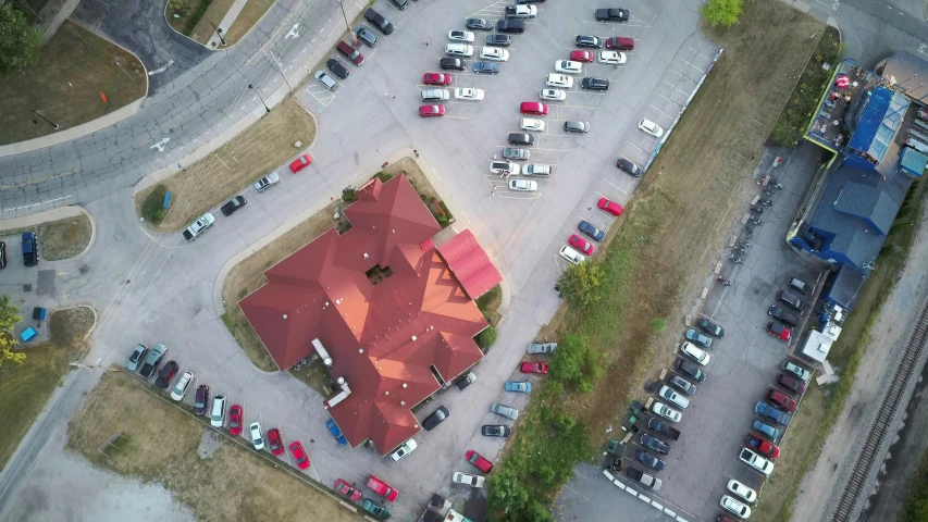 an aerial view of a parking lot with a red roof, renaissance, food pov, fan favorite, exterior shot