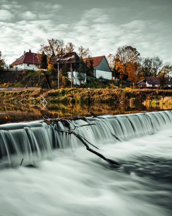 a river flowing through a lush green forest filled with trees, pexels contest winner, swedish houses, splash image, thumbnail, autum