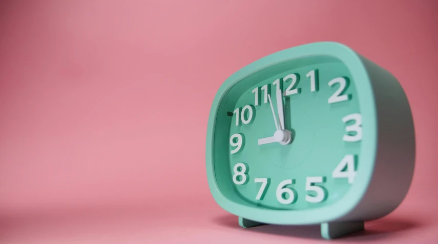a green clock sitting on top of a pink surface, trending on pexels, rectangle, late night, turquoise, 15081959 21121991 01012000 4k