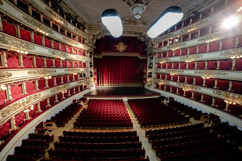 a large auditorium with red seats and a chandelier, a portrait, by Carlo Martini, pexels contest winner, baroque, square, filippo brunelleschi, portrait of a big, [ theatrical ]