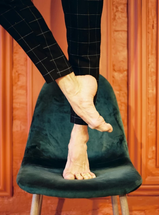 a person standing on top of a green chair, by Nina Hamnett, trending on unsplash, renaissance, real human feet, ballet style pose, sitting on man's fingertip, 15081959 21121991 01012000 4k