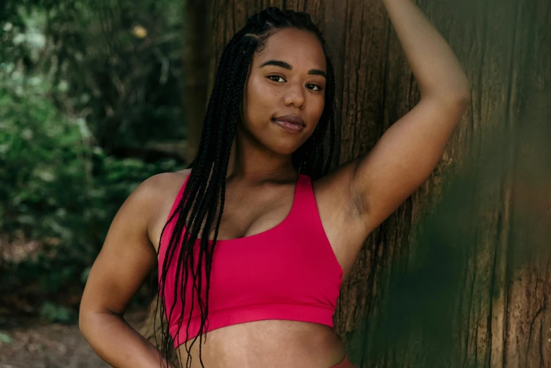 a beautiful young woman standing next to a tree, inspired by Esaias Boursse, pexels contest winner, figuration libre, hot pink halter top, cottagecore!! fitness body, ebony skin, red tank-top