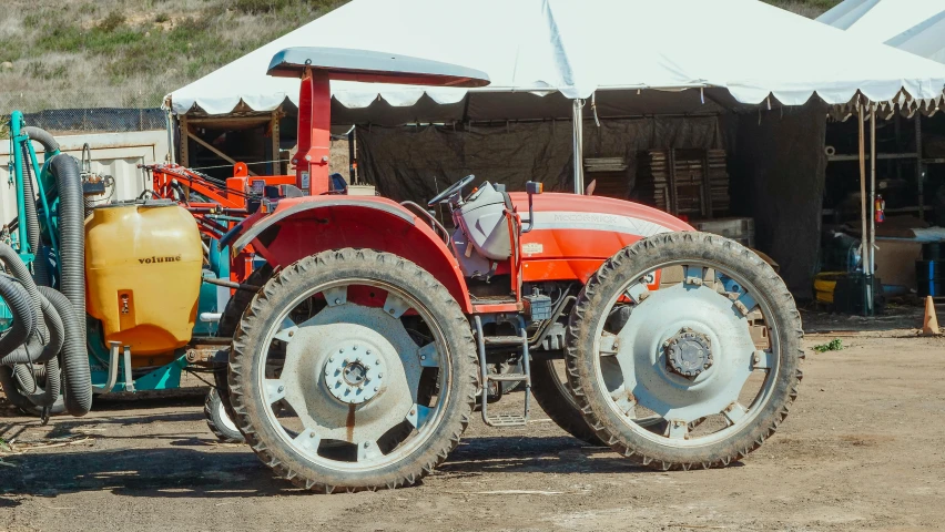 a red tractor parked in front of a white tent, unsplash, auto-destructive art, hollister ranch, music festival, 2 5 6 x 2 5 6 pixels, 🚿🗝📝