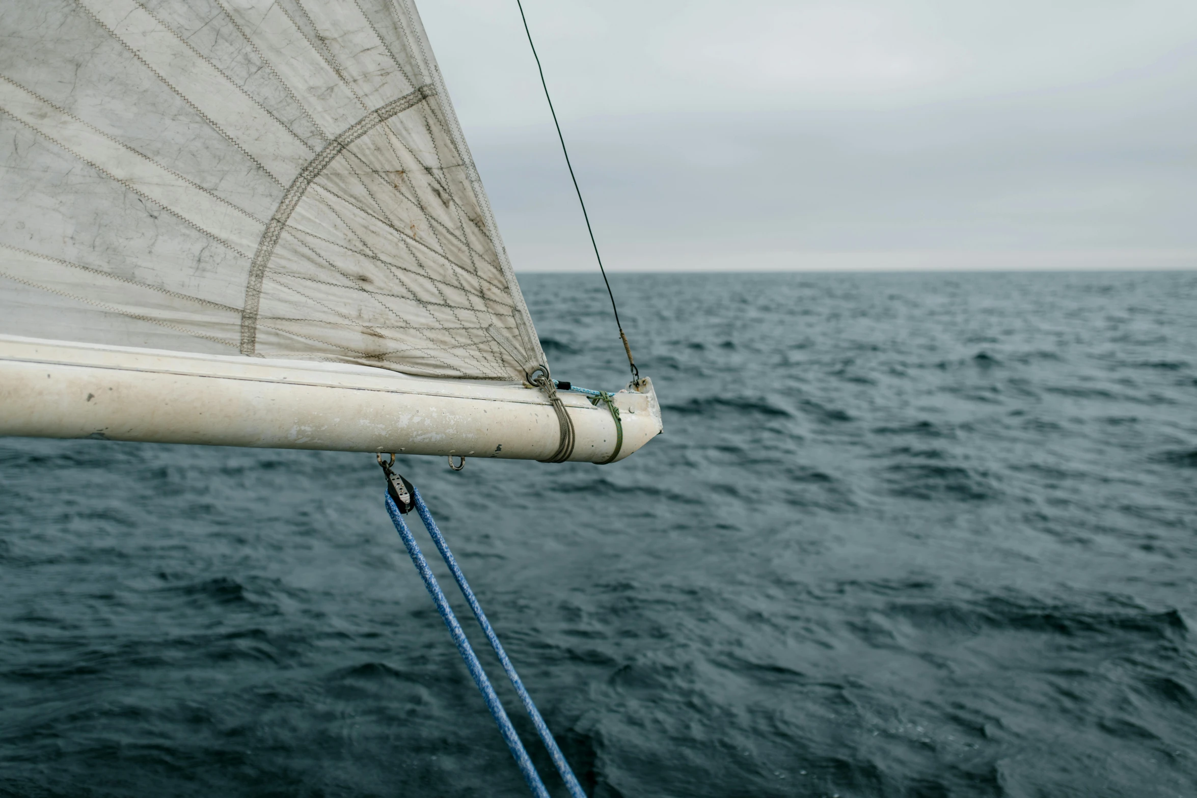 a sail boat in the middle of the ocean, pexels contest winner, renaissance, grey sky, up close, 1 2 9 7