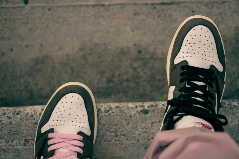 a pair of sneakers with pink laces on them, unsplash, realism, medium shot of two characters, half and half, off white, black + white