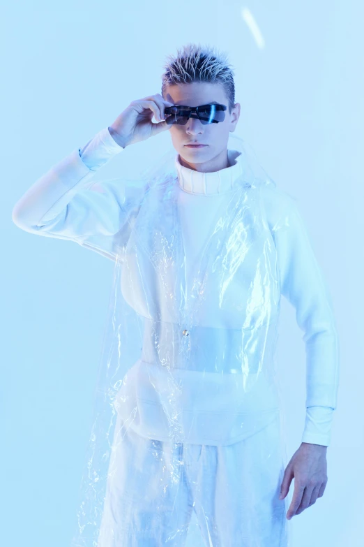 a man in a white suit and sunglasses, an album cover, inspired by Karl Buesgen, unsplash, neo-dada, wearing a plastic garbage bag, vitalik buterin, model is wearing techtical vest, official product image