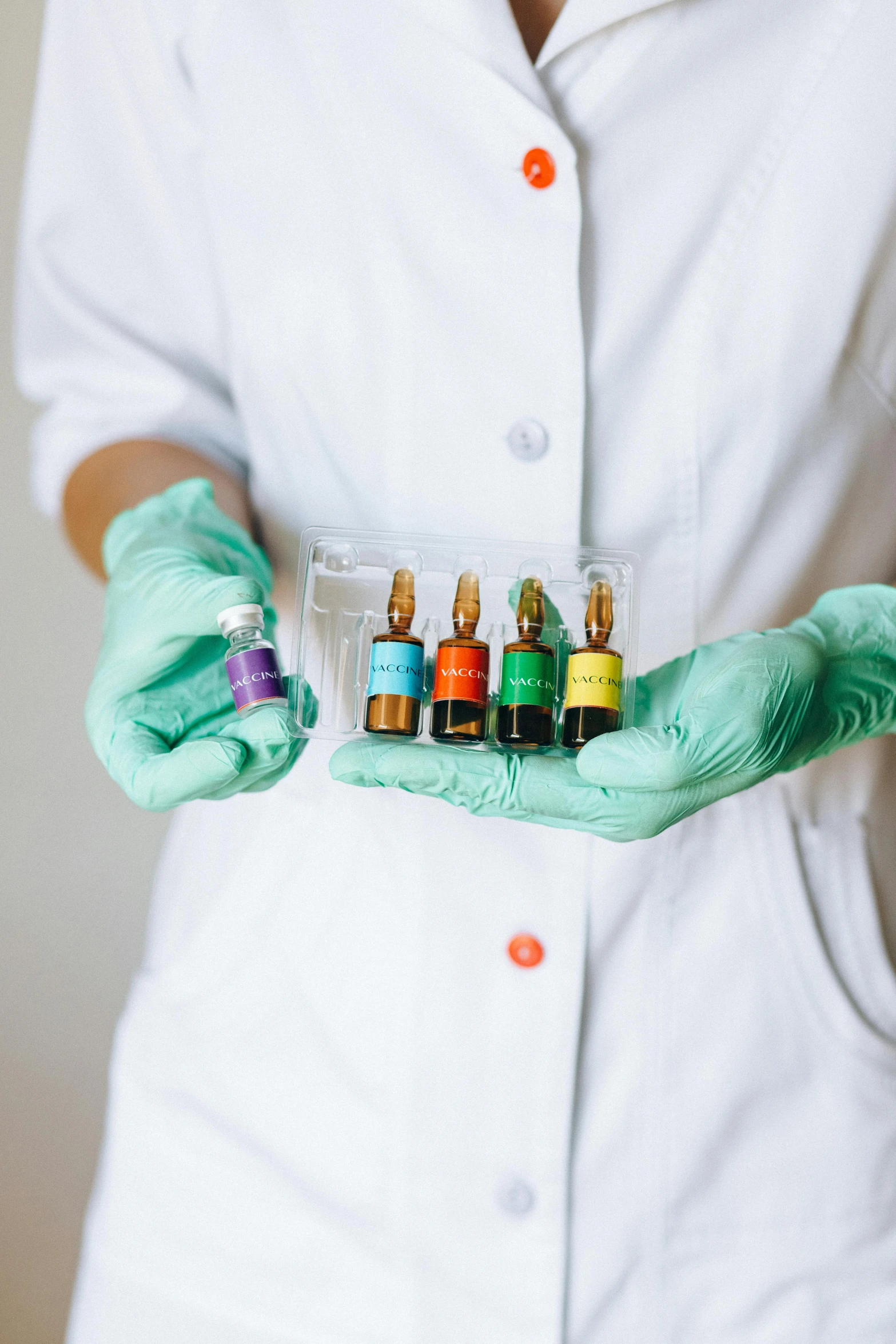 a woman in a lab coat holding a bottle of liquid, a colorized photo, pexels, vibrant vials, rainbow coloured rockets, detailed product image, diagnostics
