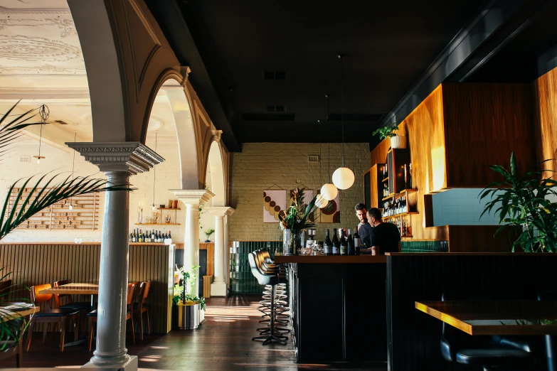 a room filled with lots of tables and chairs, a portrait, inspired by Richmond Barthé, unsplash, art nouveau, caulfield, bar, with archways, thumbnail