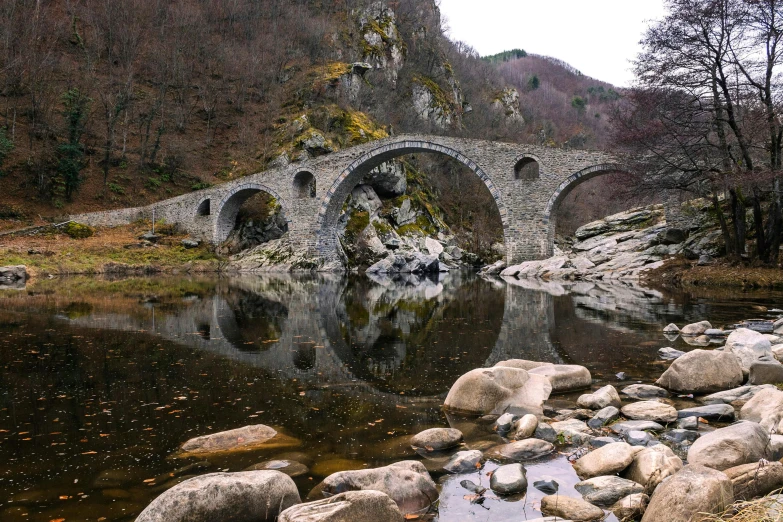 a stone bridge over a body of water, by Muggur, pexels contest winner, renaissance, pyranees, 2 5 6 x 2 5 6 pixels, greek, high quality reflections