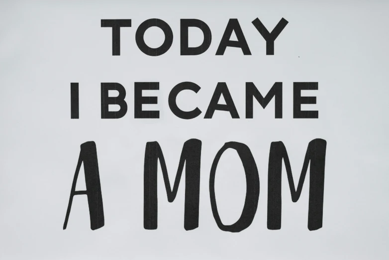 a sign that says today i became a mom, on a gray background, soami, in the style of john baldessari, 15081959 21121991 01012000 4k