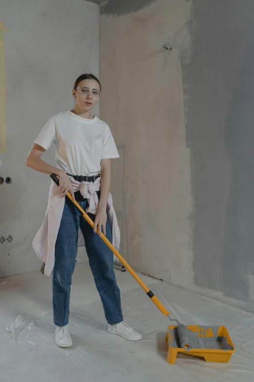 a woman is cleaning a room with a mop, pexels contest winner, arbeitsrat für kunst, portrait full body, construction, offwhite, thumbnail