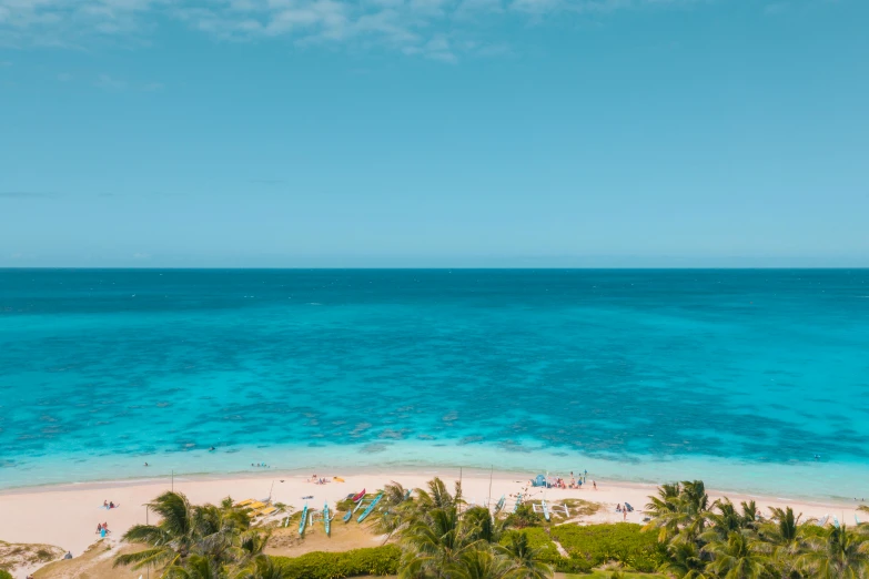 an aerial view of a beach with palm trees, by Robbie Trevino, turquoise ocean, azure blue water, joel fletcher, seaview