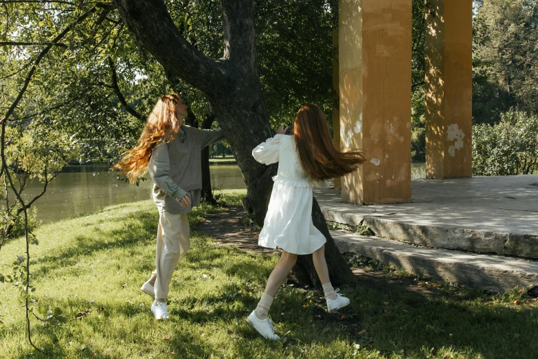 a couple of people that are standing in the grass, flowing ginger hair, dancing a jig, 15081959 21121991 01012000 4k, high quality photo