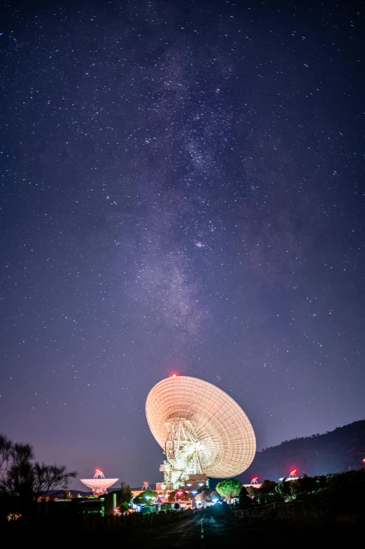 a satellite dish at night with the milky in the background, unsplash contest winner, light and space, australia, cosmic architecture, closeup!!!!!!, mythical cosmic shrine