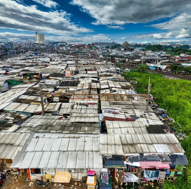 a large group of shacks sitting on top of a lush green field, inspired by Joze Ciuha, pexels contest winner, renaissance, in a massive cavernous iron city, unmistakably kenyan, fujifilm”, a wooden