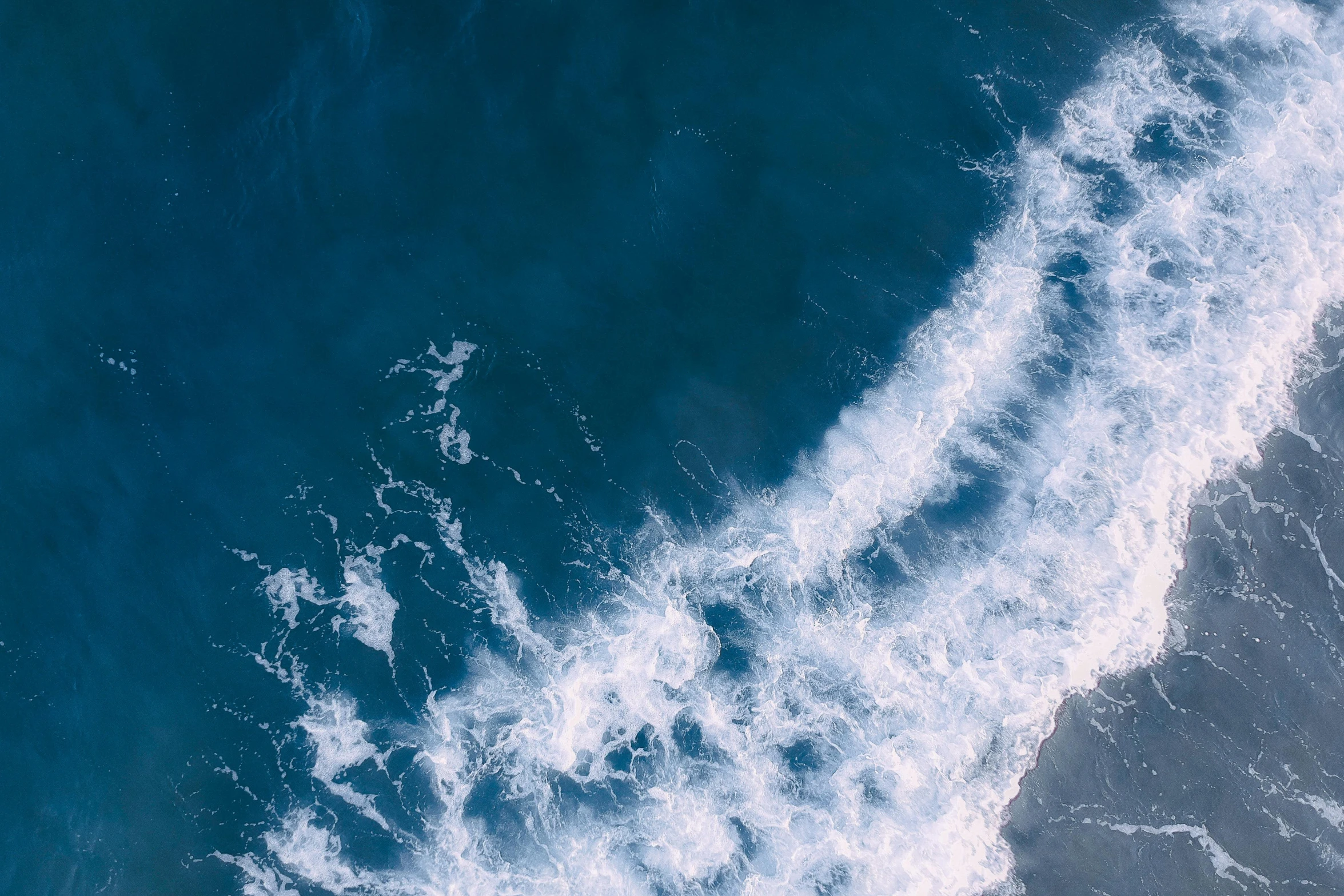 a person riding a surfboard on top of a wave, pexels contest winner, happening, satellite view, ocean spray, thumbnail, blue