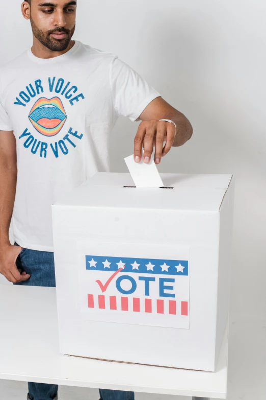 a man putting a vote into a voting box, by Everett Warner, shutterstock contest winner, printed on a cream linen t-shirt, cardboard cutout, front on, teenager